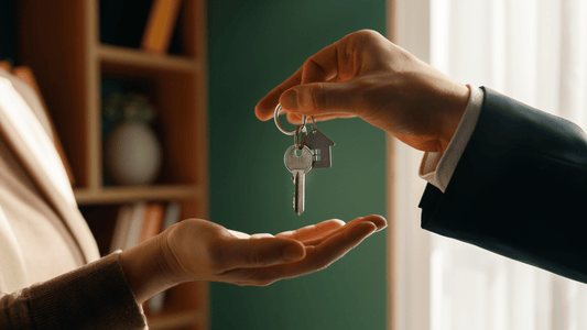 Real estate agent handing over villa keys to a seller or buyer during a property transaction in Spain