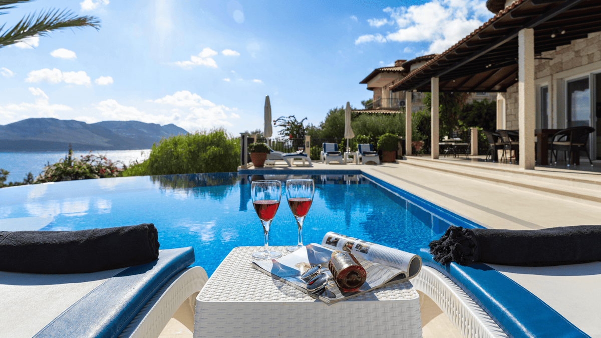 Mediterranean-style villa in Spain with private swimming pool and outdoor lounge area overlooking the sea