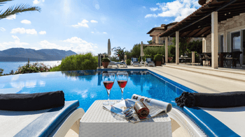 Mediterranean-style villa in Spain with private swimming pool and outdoor lounge area overlooking the sea