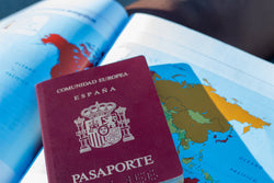 Spanish passport on a globe map