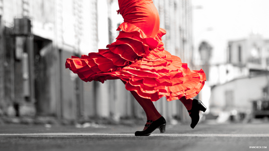 Woman in flamenco dress dancing flamenco