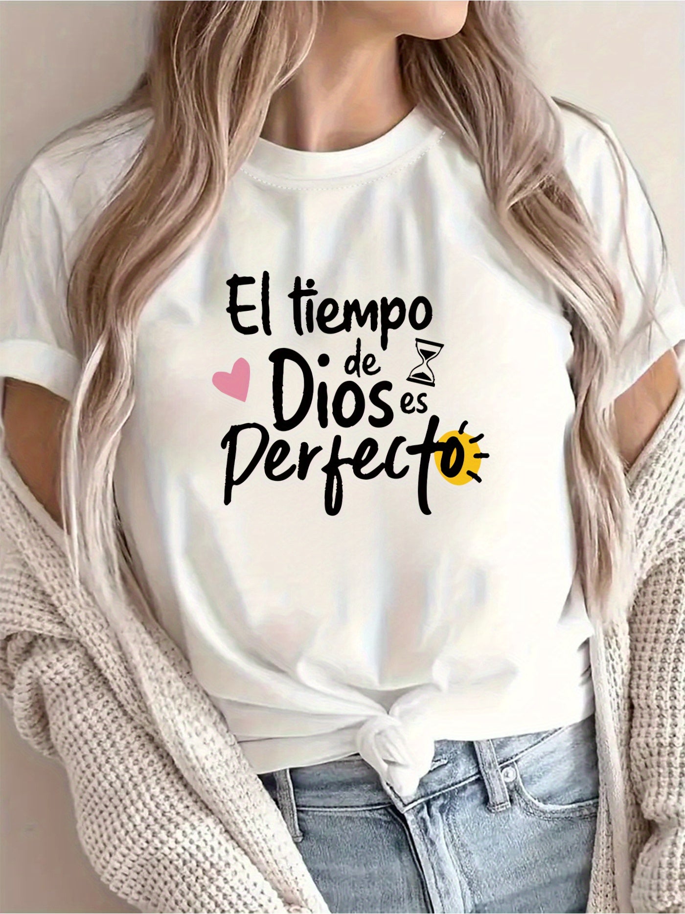 Person wearing a white t-shirt with Spanish text and graphics.