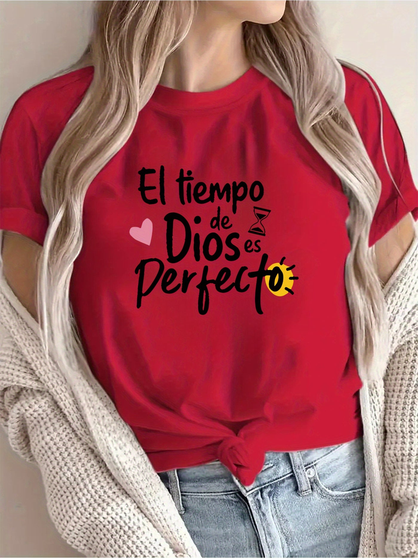 Person wearing a red t-shirt with Spanish text and graphics.