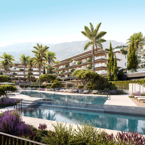Modern apartment complex with a pool and palm trees in Mijas, Costa del Sol.