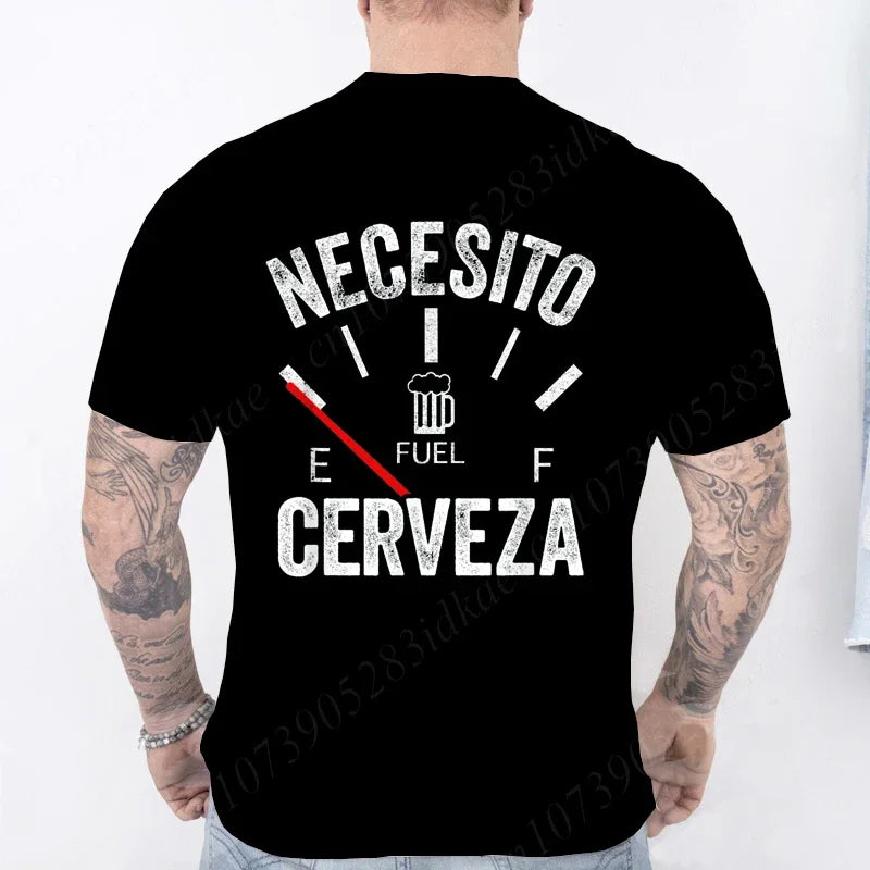 Black t-shirt with white text 'NECESITO CERVEZA' on the back, worn by a person with tattoos.