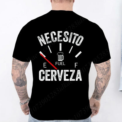 Black t-shirt with white text 'NECESITO CERVEZA' on the back, worn by a person with tattoos.