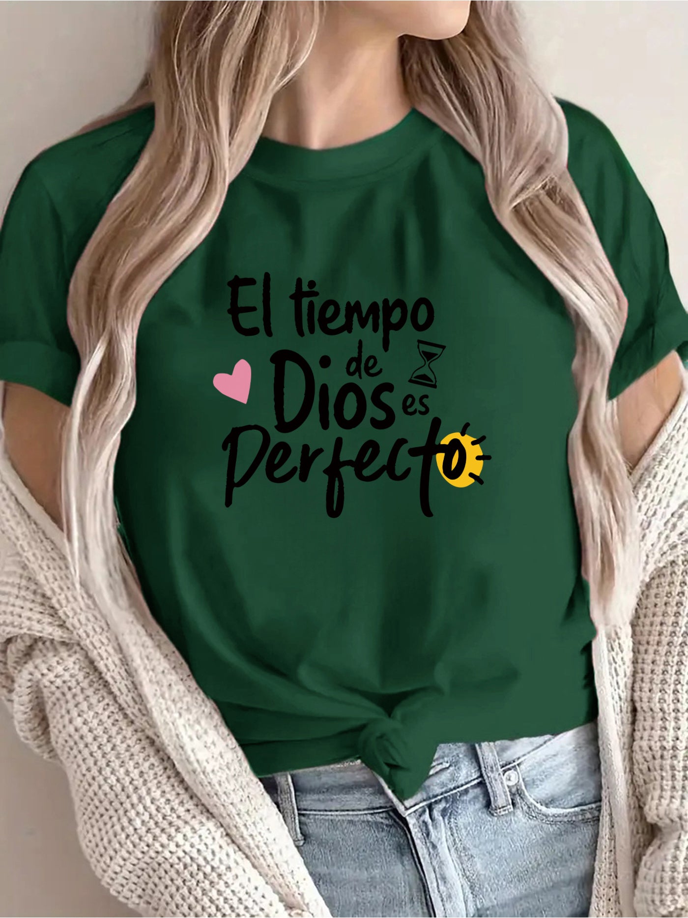 Person wearing a green t-shirt with Spanish text and graphics.