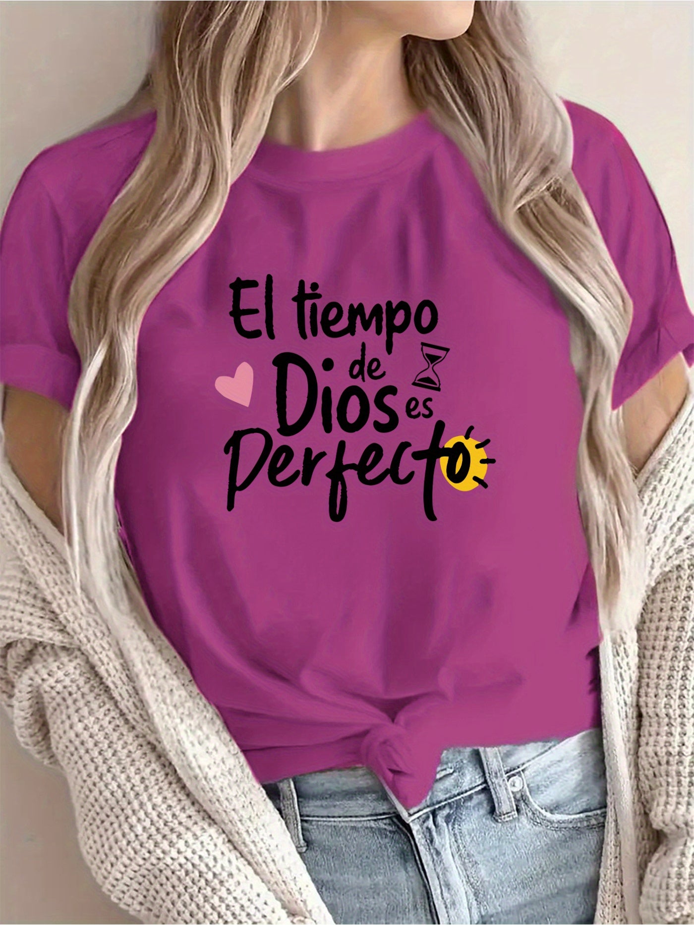 Purple t-shirt with Spanish text worn by a person, with a neutral background
